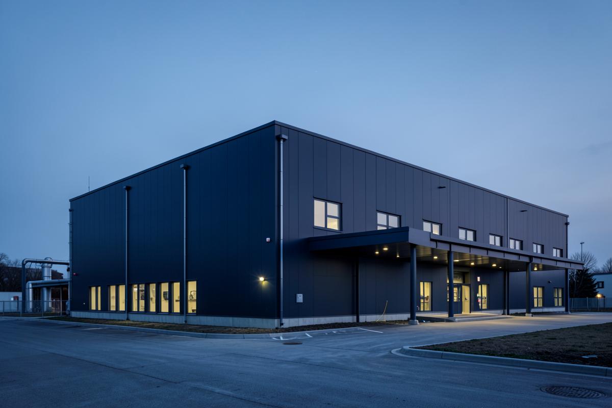 Modern waste-to-energy facility at dusk